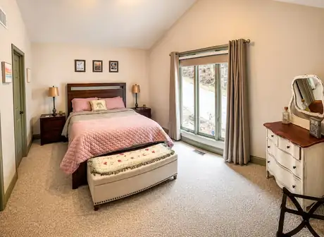 Bedroom three with a queen bed