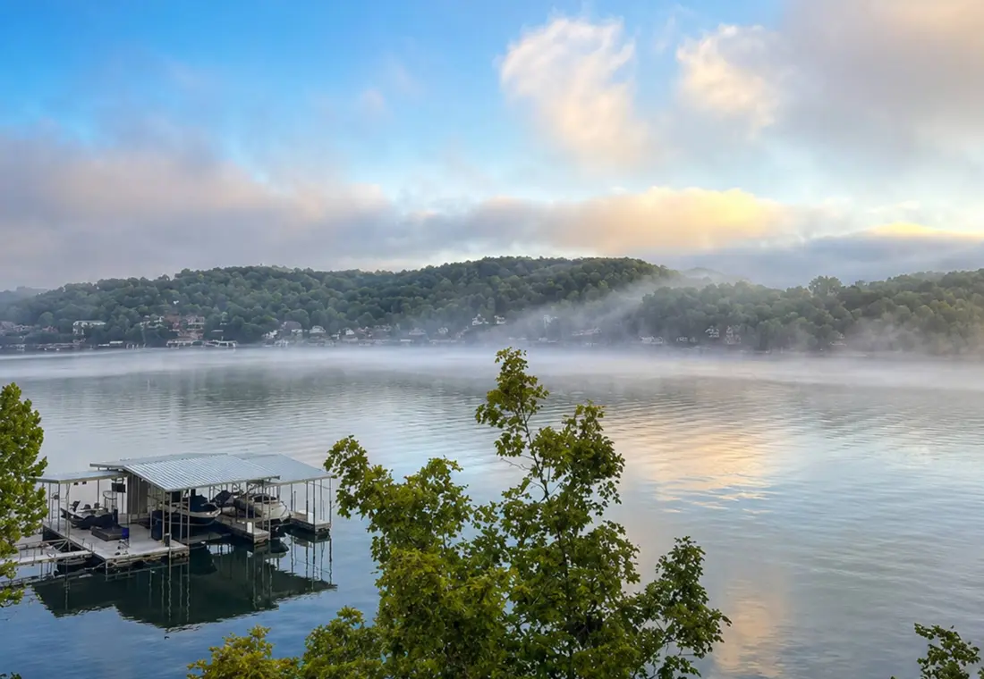 Morning mist lying over the cove above the dock
