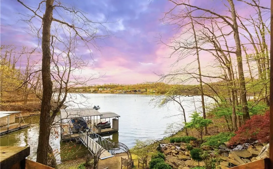 The cove and the dock at dusk in early spring, seen from above the house